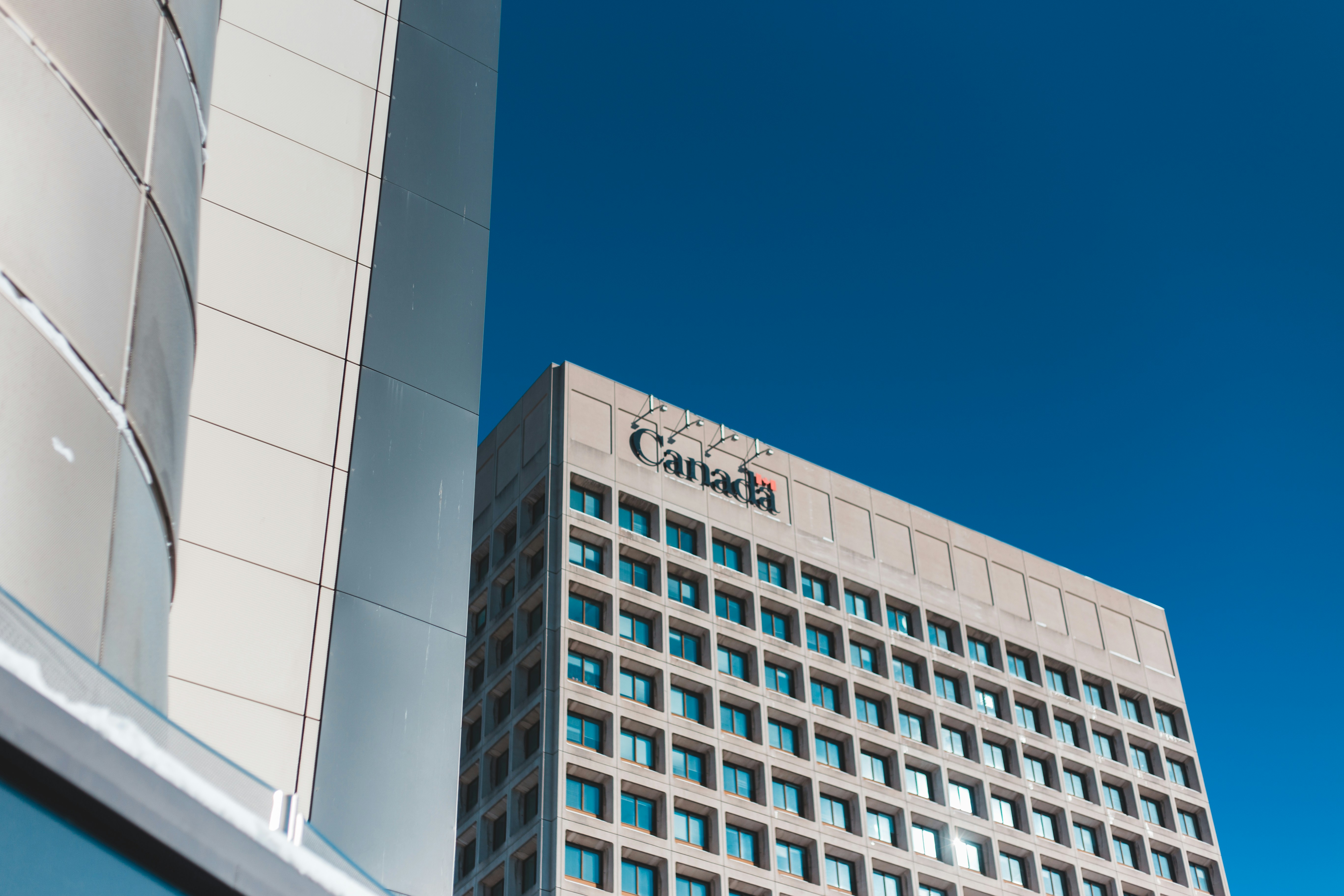 white concrete building under blue sky during daytime